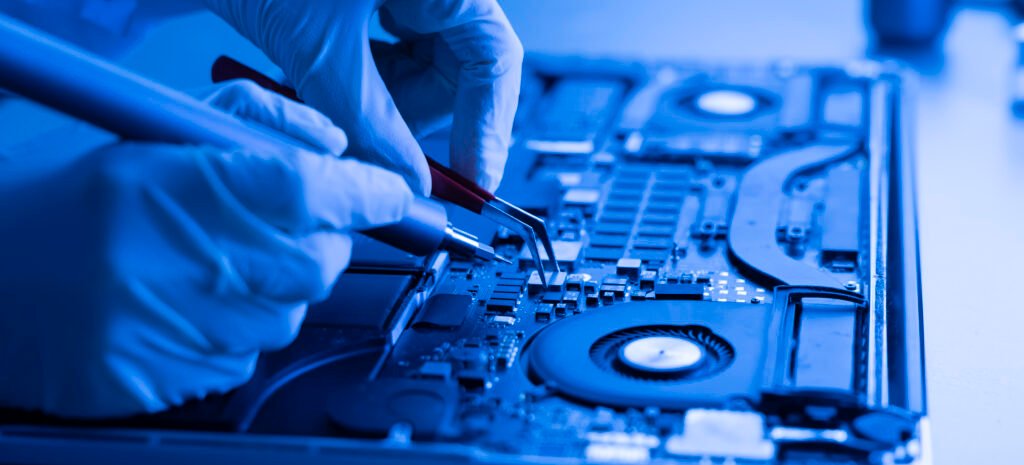 a computer warranty guarantee, hands work with computer components