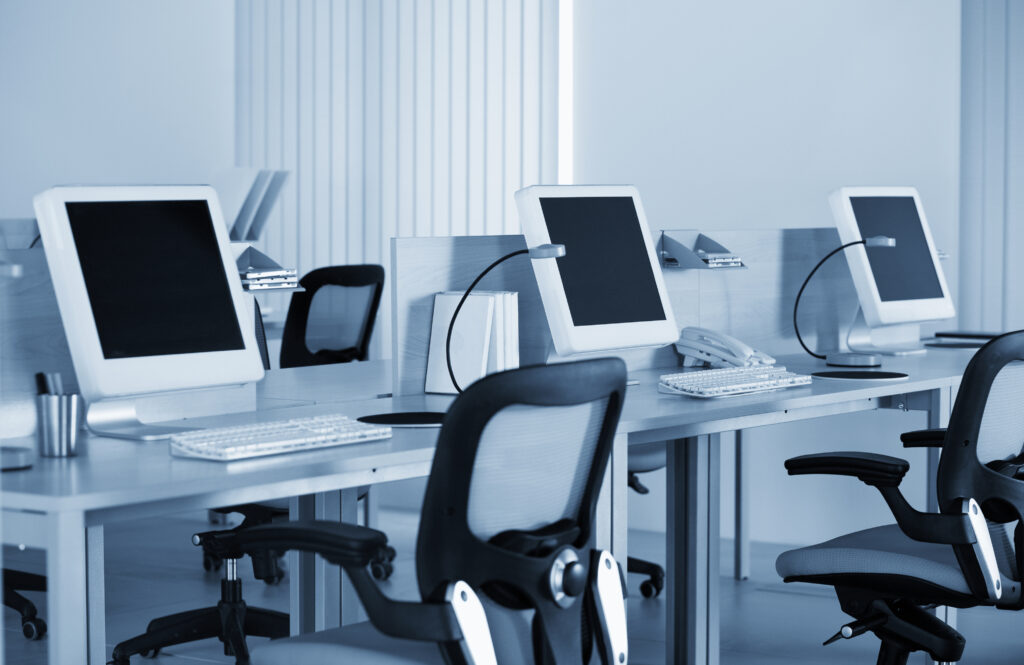 Сomputers with lcd screens in modern office in the blue tilt